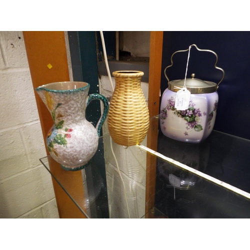 118 - A pottery jug, a West Germany vase and a floral decorated biscuit barrel