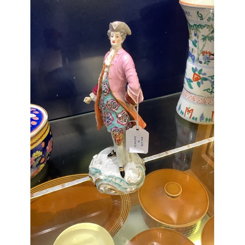 59 - A continental porcelain figure of a dandy