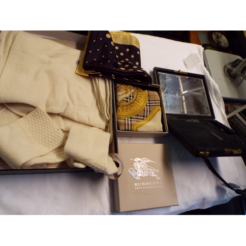 261 - A boxed silk headscarf, a Dean and White cashmere scarf and gloves, a boxed Burberry silk scarf and ... 