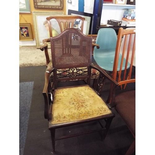 446 - An Edwardian mahogany inlaid elbow chair with bergere back panel, tapestry seat resting on tapering ... 