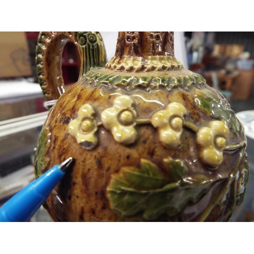 2 - A circa 1880s brown glazed Rye Pottery ewer with sprigged oak leaf and flower heads, the looping han... 