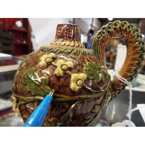 2 - A circa 1880s brown glazed Rye Pottery ewer with sprigged oak leaf and flower heads, the looping han... 