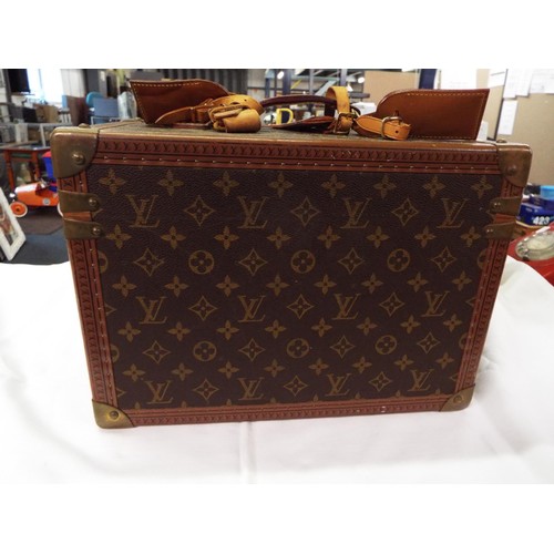 38 - A Louis Vuitton trunk vanity case with three leather labels, internal mirrored case is missing