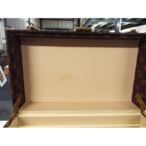 38 - A Louis Vuitton trunk vanity case with three leather labels, internal mirrored case is missing