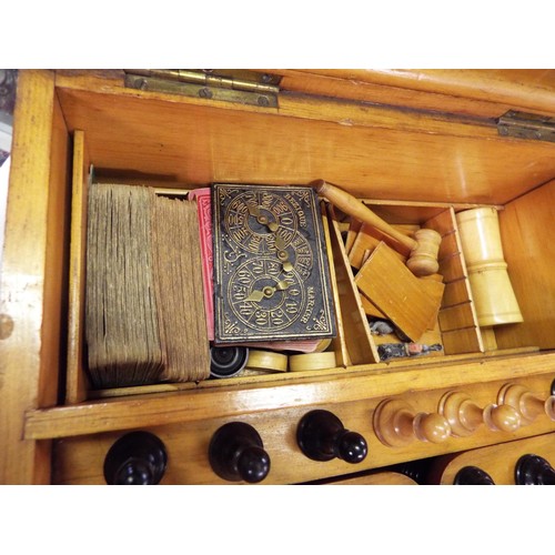 39 - A mid Victorian 'Golden Oak' Royal Cabinet of Games and Games Compendium the hinged lid and frontage... 