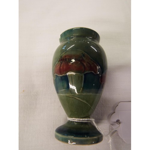 45 - A 1919 Moorcroft miniature green glazed vase signed to base (small rim chip)