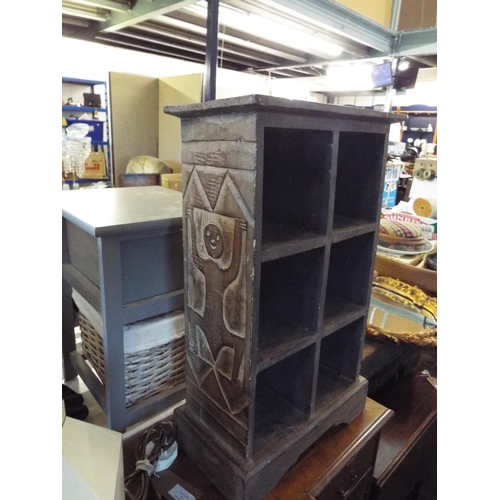 534 - A carved wooden shelf unit