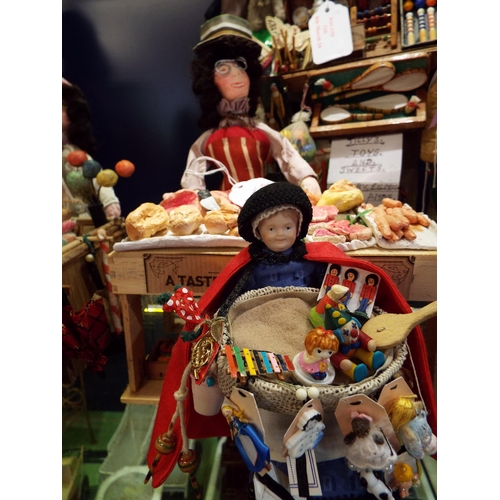 127 - A small Pedlar doll portraying the Cryes Of London and Inerant Merchants of Early England and Americ... 