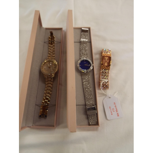 172 - Two boxed Diamonique fashion watches together with another