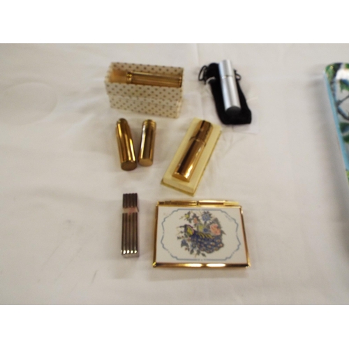 178 - A selection of lipstick holders and perfume bottles and a Stratton notebook holder