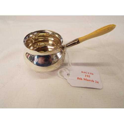 195 - A Carrington's of London, 130 Regent Street, 1963 silver sauce pourer with bone handle total weight ... 