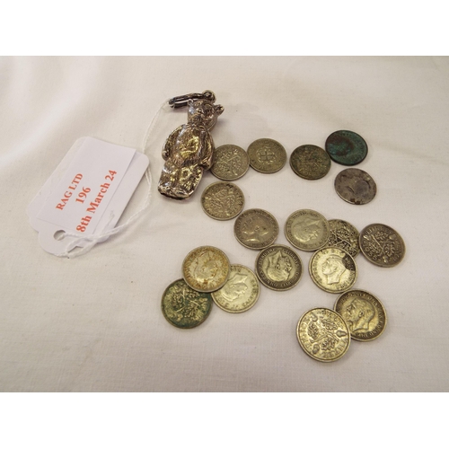 196 - A silver rattle with a selection of 3d coins