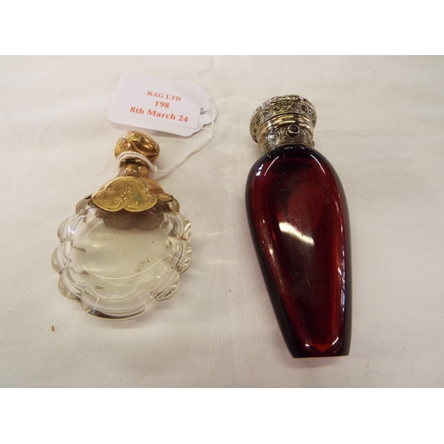 198 - A ruby red glass and plated top scent bottle and a yellow metal mounted example