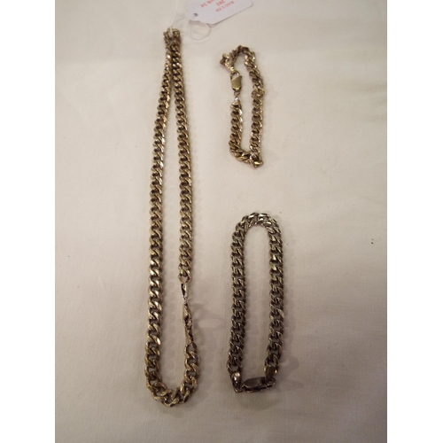 202 - A silver curb link necklace and two bracelets total weight 3.36oz