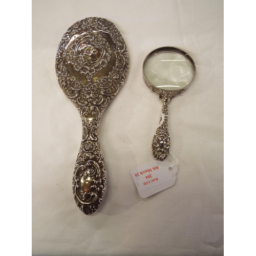 204 - A Birmingham silver dressing table mirror together with a German silver magnifying glass