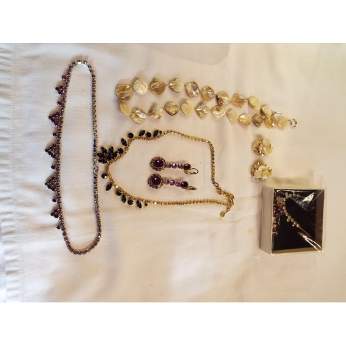 210 - A mixed selection of vintage costume jewellery to include paste set necklaces and matching earrings ... 