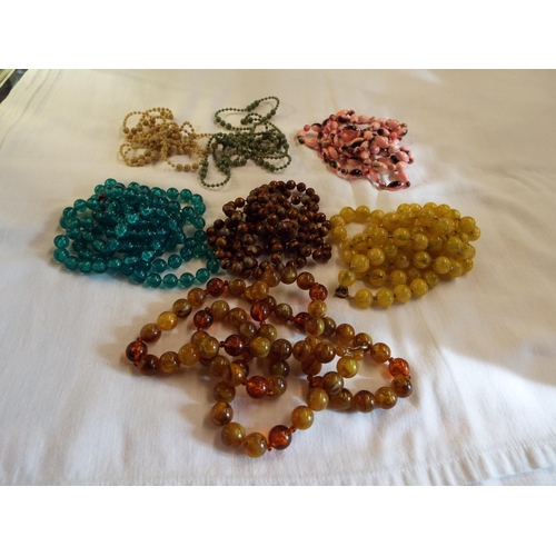 215 - Seven assorted vintage flapper style beaded necklaces