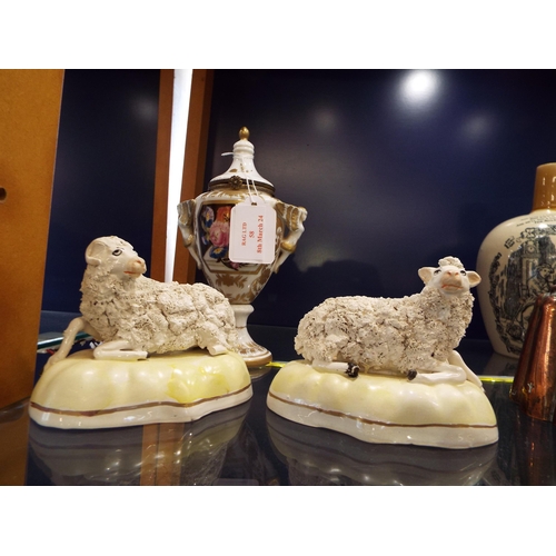 58 - A pair of Staffordshire sheep (one A/F) together with a china vase with floral decoration