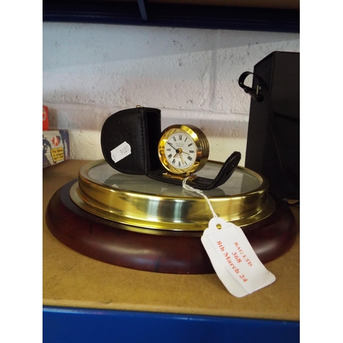 368 - A circular wall clock and small alarm clock