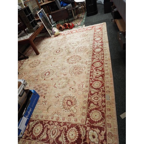 529 - A red ground rug having stylised pattern 126” x 92”