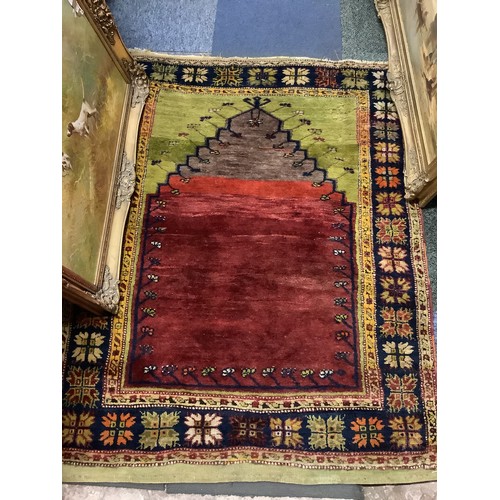 528 - A vintage red and blue prayer rug 56