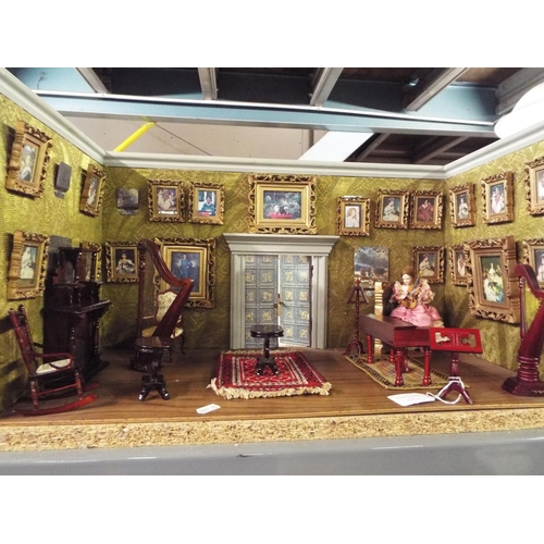 473 - A dolls house music room with accessories, approximately 33 cm high