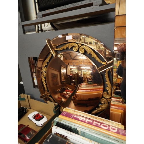516 - An Art Deco style two-tone circular mirror with copper effect