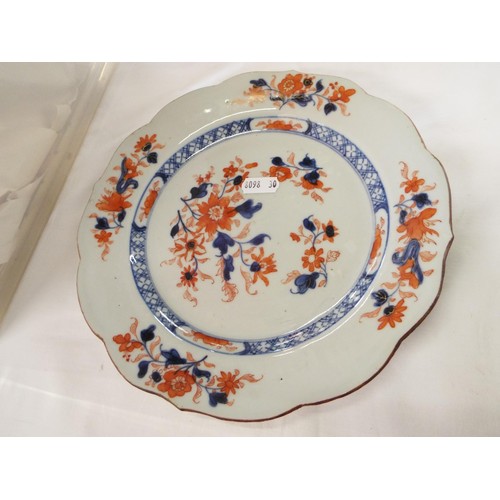 42 - A pair of early Chinese plates with blue and red floral decoration