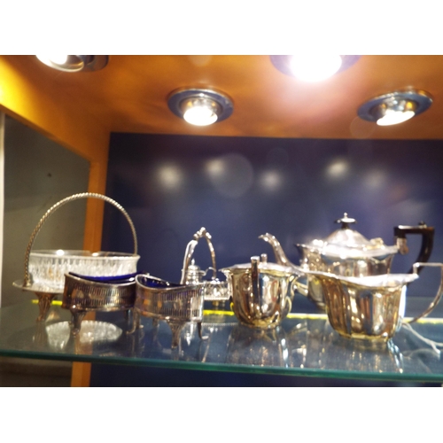 81 - A selection of silver-plated items to include two large salts with liners, basket, a tea-set etc
