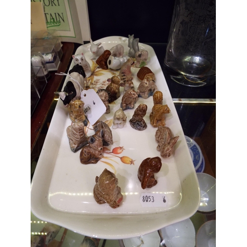 88 - A selection of china figures to include Wade whimsies etc