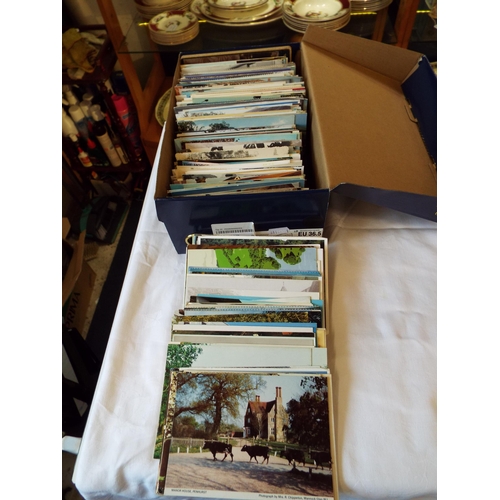 106 - A box of assorted topographical postcards to include scenic, architectural, landscape etc