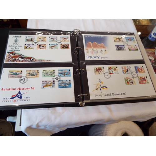 112 - An album housing a quantity of Guernsey and Jersey First Day Covers to include 'Women of Achievement... 