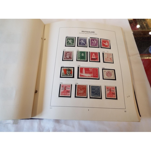 116 - A folder housing a collection of East Germany stamps dated from 1949-1975 to include an almost compl... 
