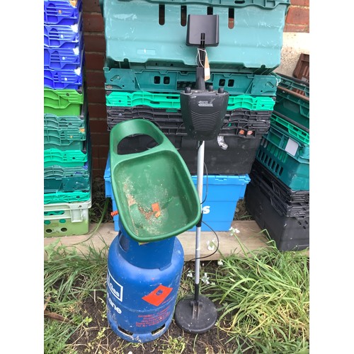 386 - A child's metal detector together with a Calor gas bottle and a seeder