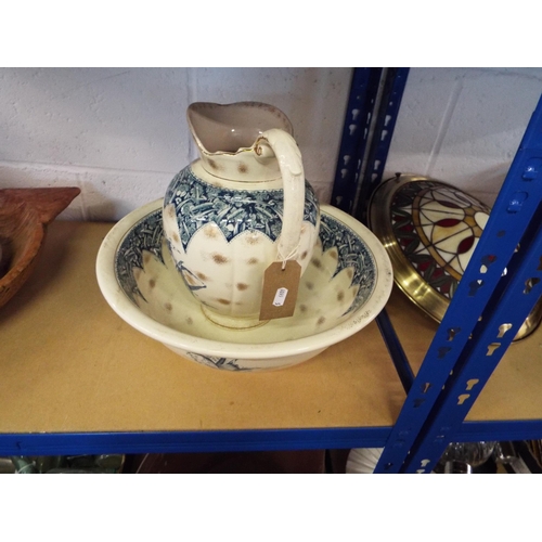411 - A Victorian washbowl and jug having green floral decoration