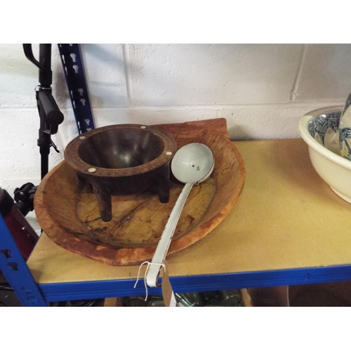 412 - A wooden rustic bowl, a carved African food bowl and an enamel ladle