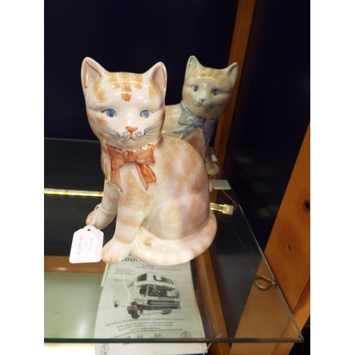 A pair of Rye Pottery male and female cats