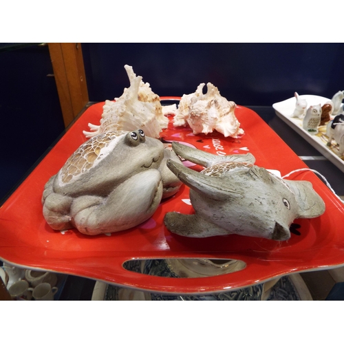 55 - A selection of sea shells and two carved fish