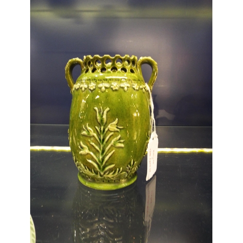 7 - A Fred Masters Bognor Pottery green glazed two handle vase having reticulated border top with applie... 