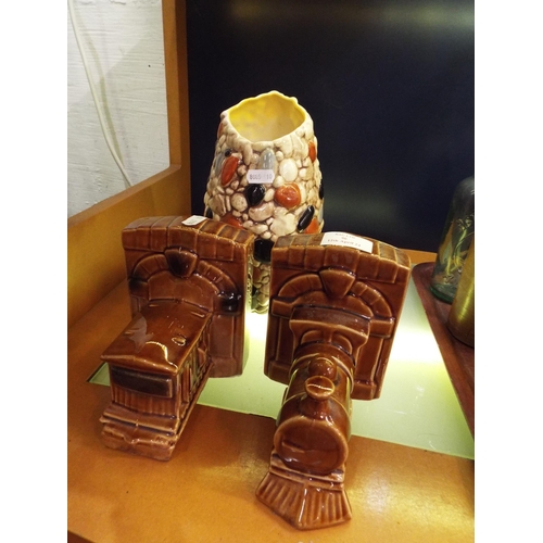 96 - A pair of china bookends in the form of a locomotive and a Sylvac pebble vase