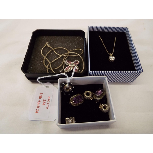 234 - Two 925 silver necklaces together with two Pandora charms plus two others and a pair of clip on earr... 