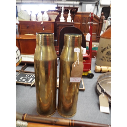 299 - Two vintage brass shells