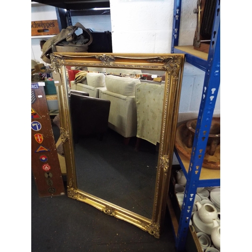 374 - A large gilt framed bevel glass mirror