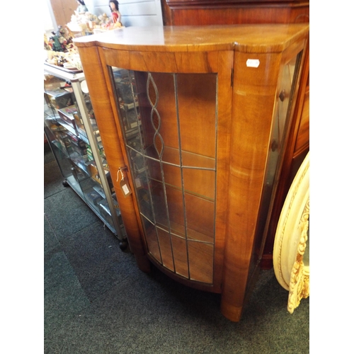 523 - An Art Deco walnut bow front glass display cabinet