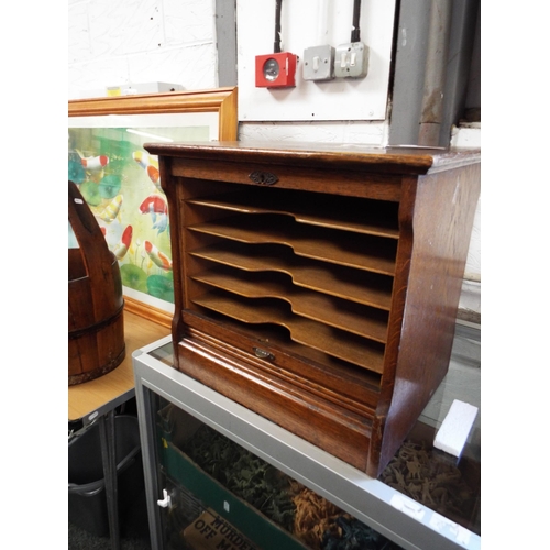 525 - An oak tambour fronted filing cabinet