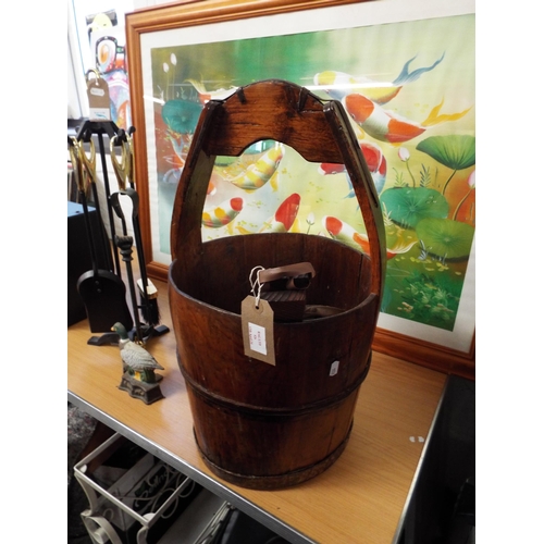 526 - A vintage wooden well bucket and a pair of bellows