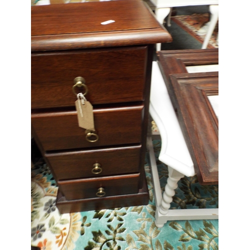 560 - A stained wood chest of four short drawers