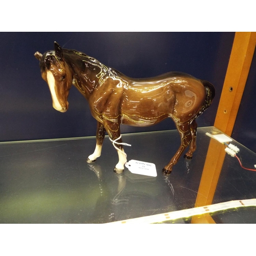 12 - A brown glazed Beswick horse