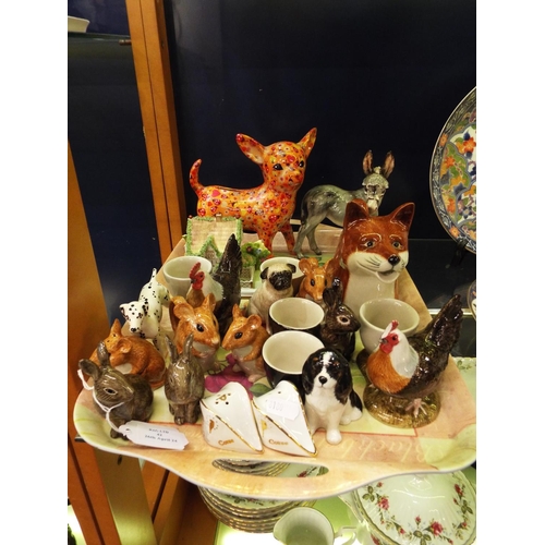 42 - A mixed selection of assorted china to include a donkey, pastille burner money boxes etc