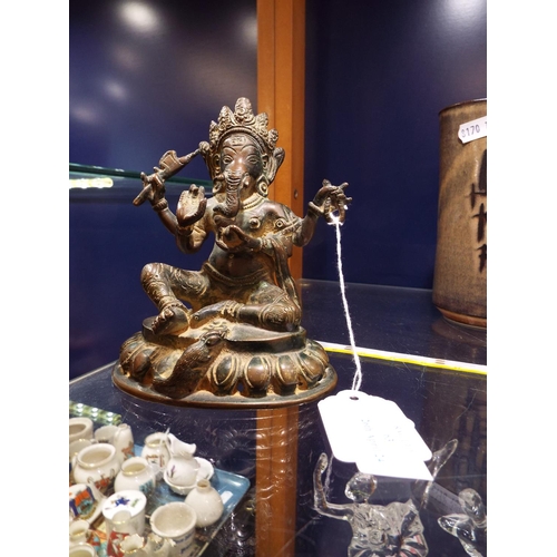 63 - An early bronze Indian model of Ganesha